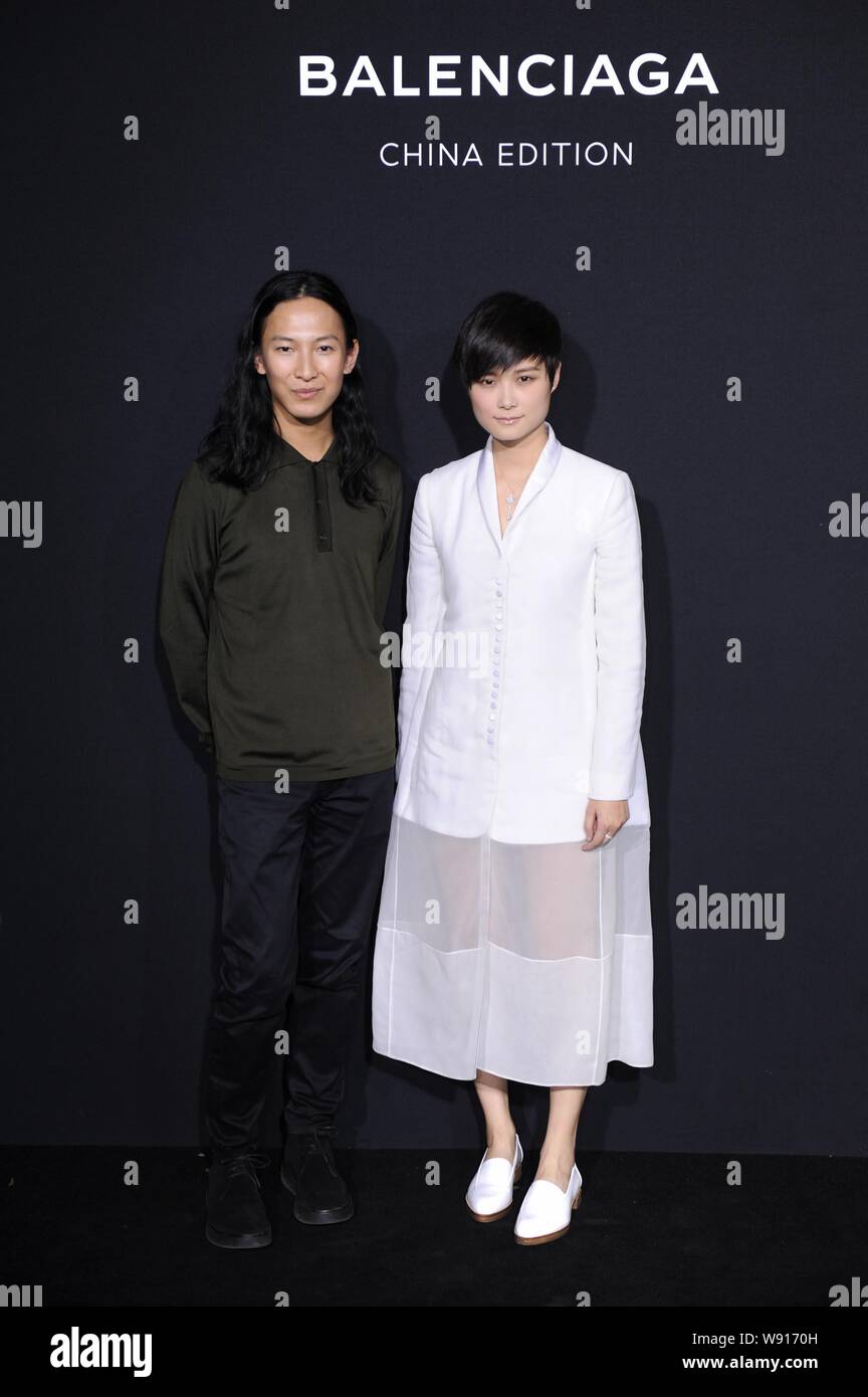 Chinese singer and actress Li Yuchun, right, poses with American fashion  designer Alexander Wang, Creative Director of Balenciaga, during the  fashion Stock Photo - Alamy