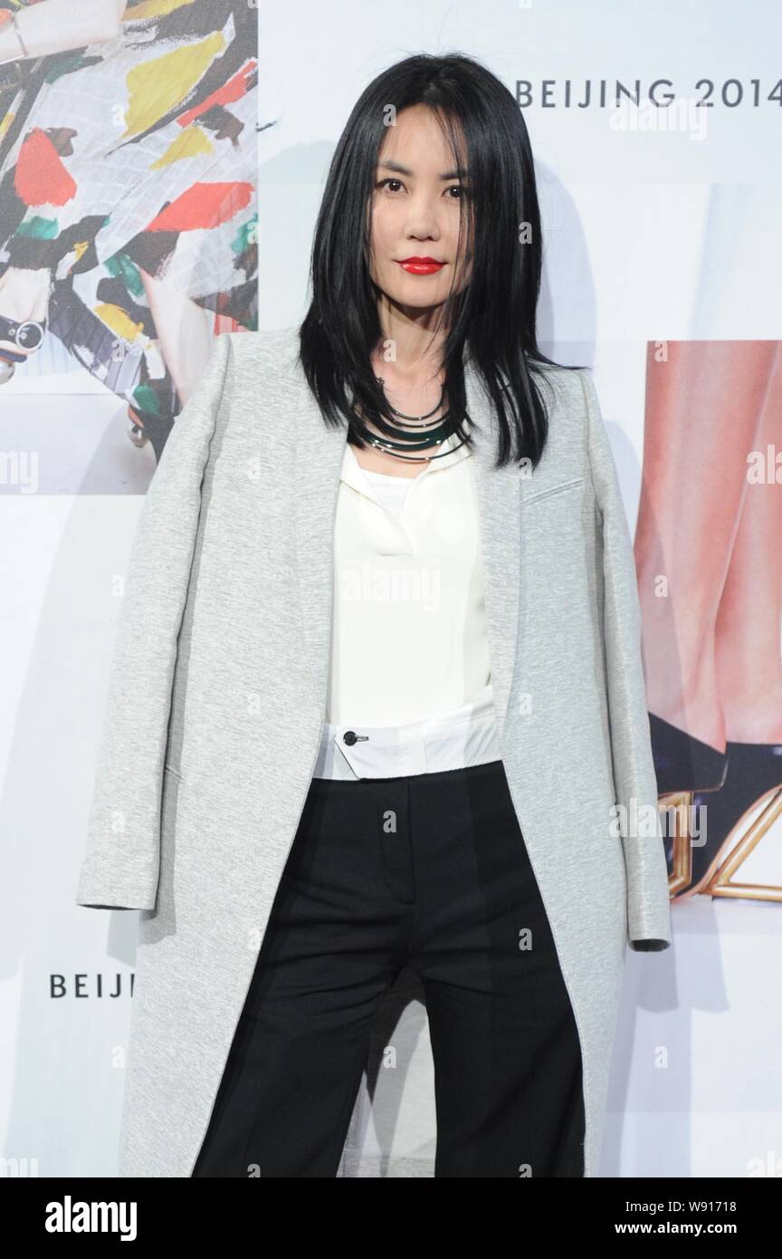 Hong Kong singer Faye Wong poses as she arrives at the Celine 2014 Fall/Winter fashion show in Beijing, China, 22 May 2014. Stock Photo