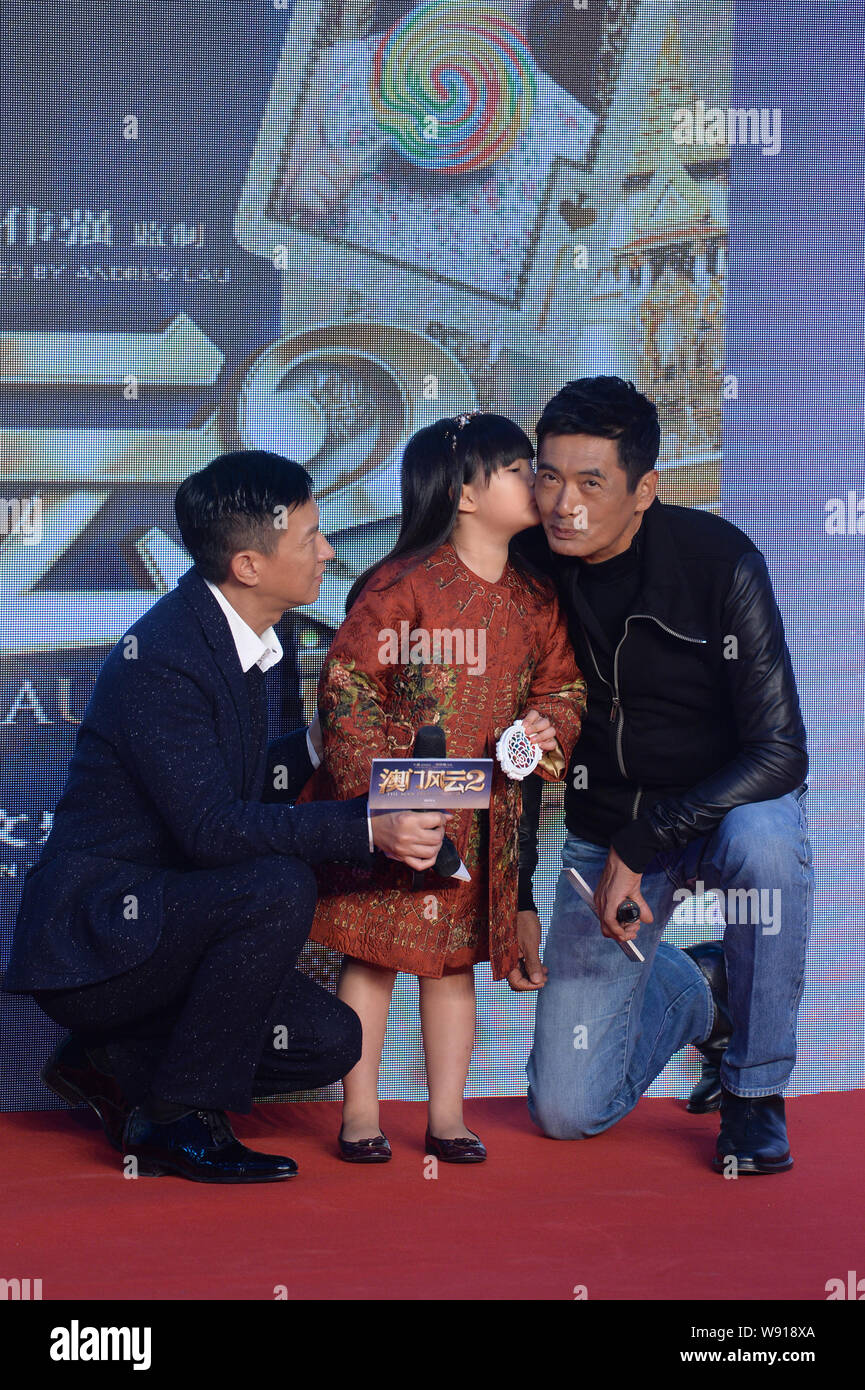 Hong Kong actor Nick Cheung, left, looks at Angela Wang Shiling, center ...