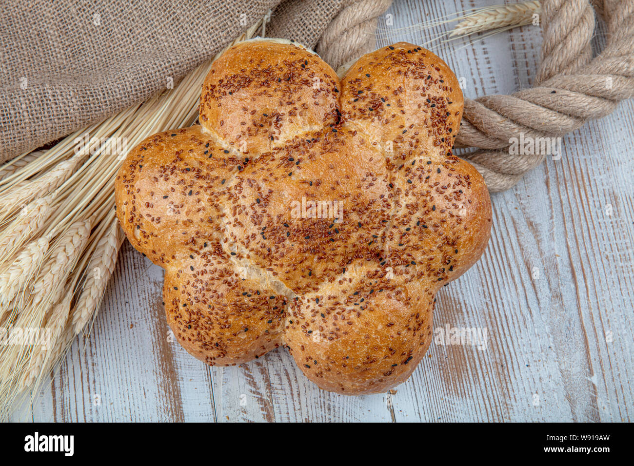 Flowers bread, bread in the form of bricks and flower on a wooden