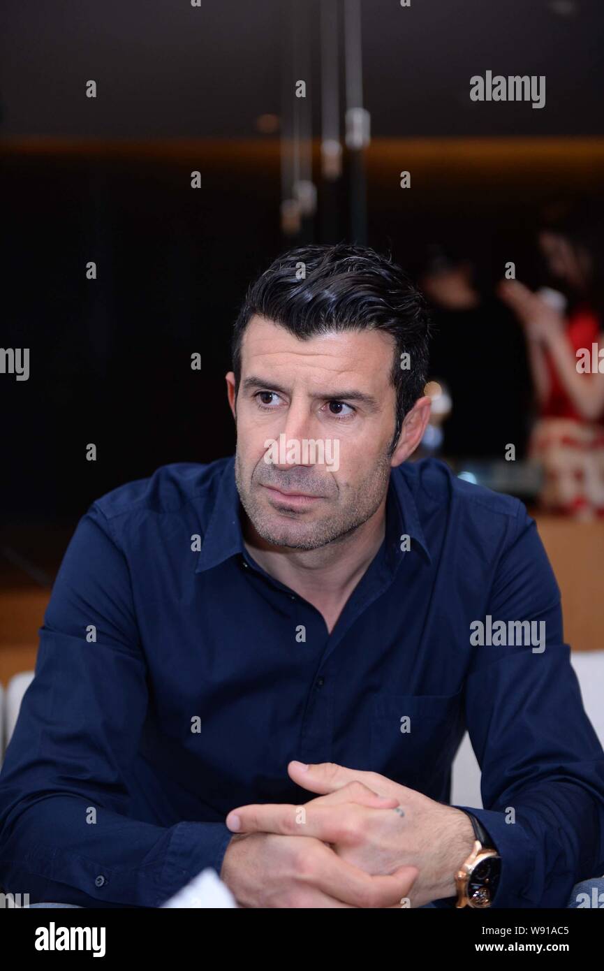 Portuguese football star Luis Figo listens at an interview by BAZAAR Mens Style magazine in Beijing, China, 12 March 2014.   Portuguese football star Stock Photo