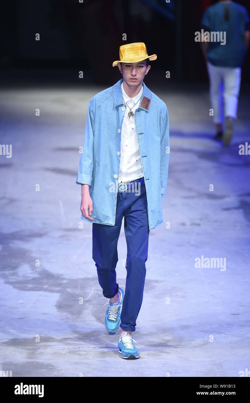A model displays a new creation by designer Liu Yiqun at the Wolfzone ...