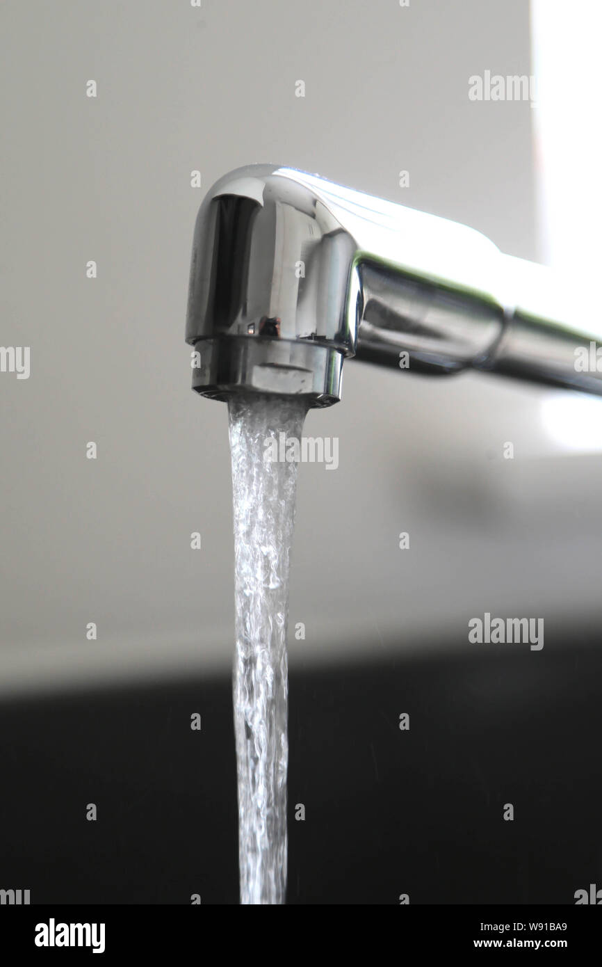 Running kitchen water tap Stock Photo Alamy