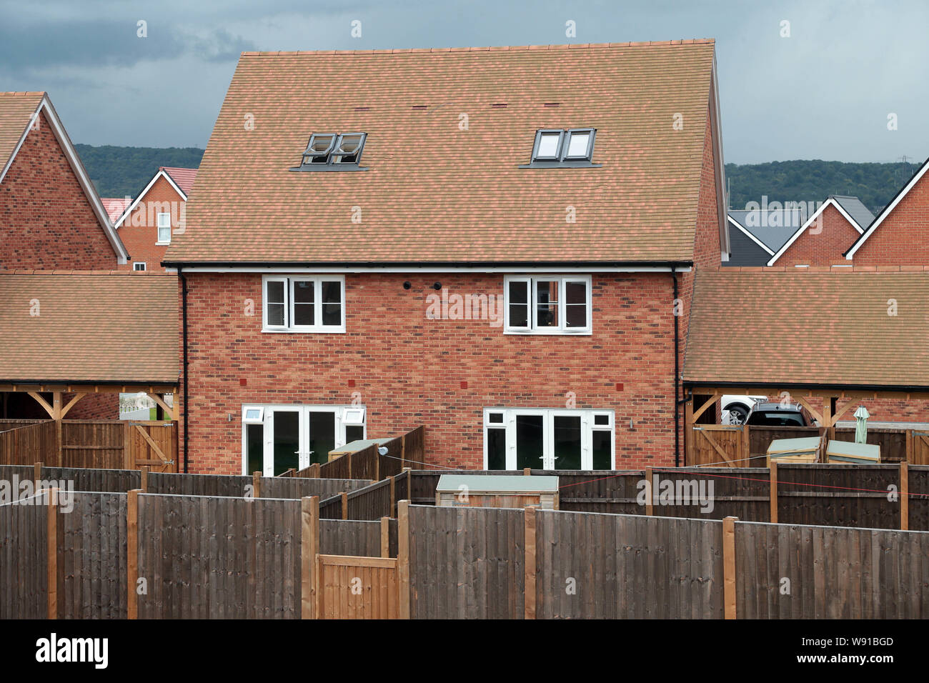 Maze of  small back gardens on a new housing estate in Kent built by Bellway Homes on a brownfield site which was a former cement works. Stock Photo