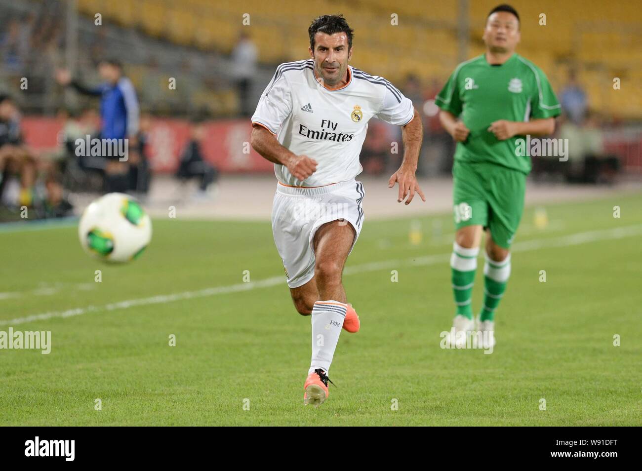 Lewis Figo Portuguese football star Luis Figo of Real Madrid Leyendas, front, runs ...