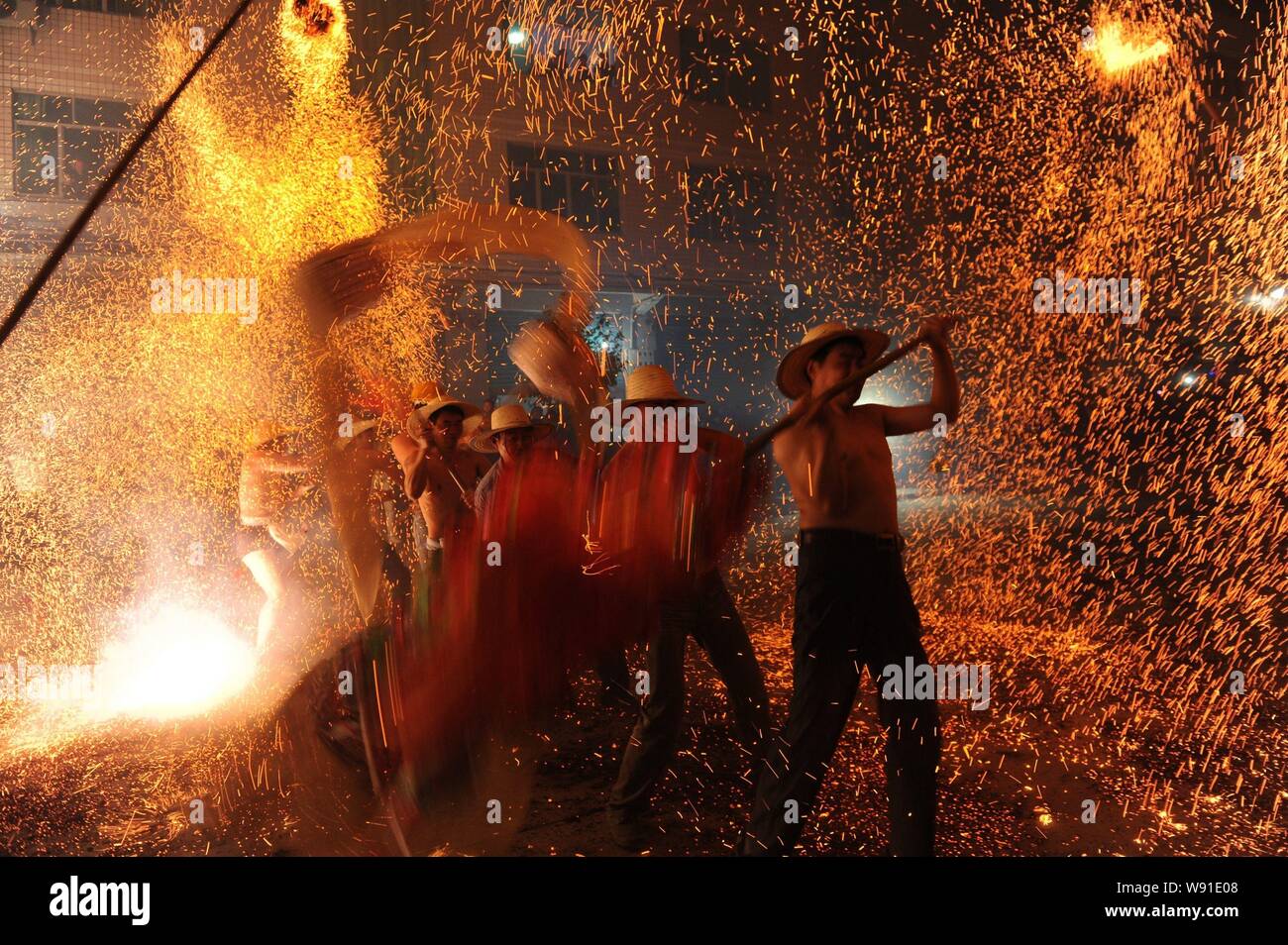 Fire dancers china hi-res stock photography and images - Alamy