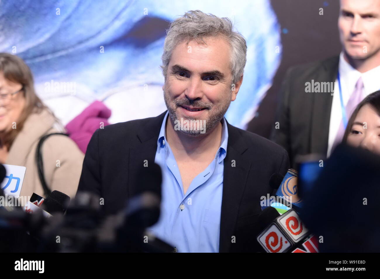 Mexican film director Alfonso Cuaron, center, smiles during a press ...