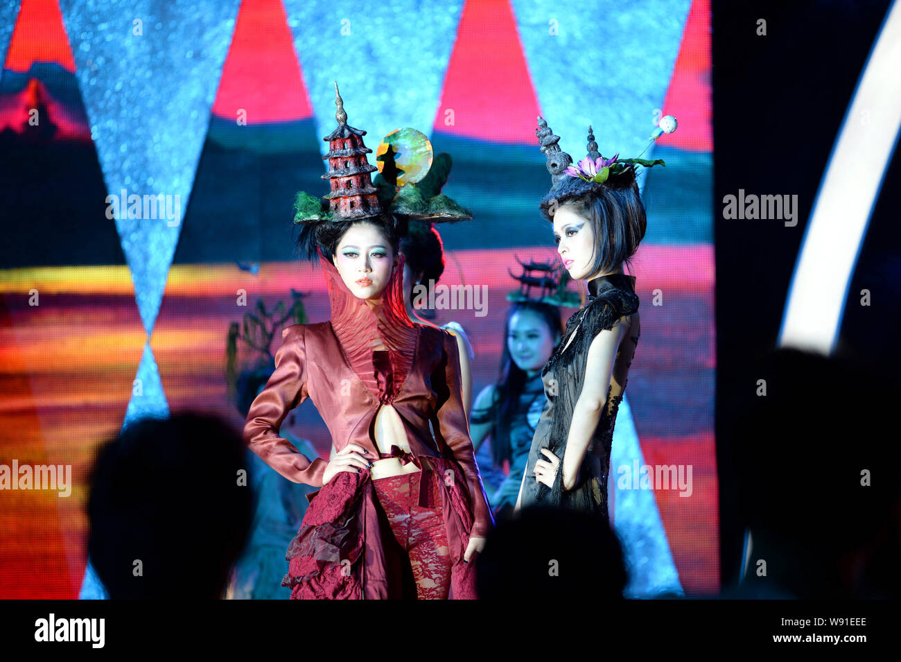 Chinese models display new hairstyle creations showing Sunset Glow over Leifeng Pagoda, left, and Three Pools Mirroring the Moon, rigth, two of the Te Stock Photo
