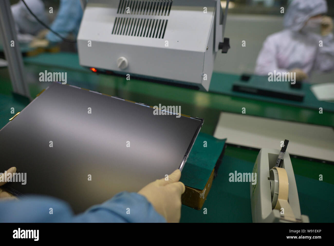 FILEChinese workers assemble flatpanel displays at the plant of