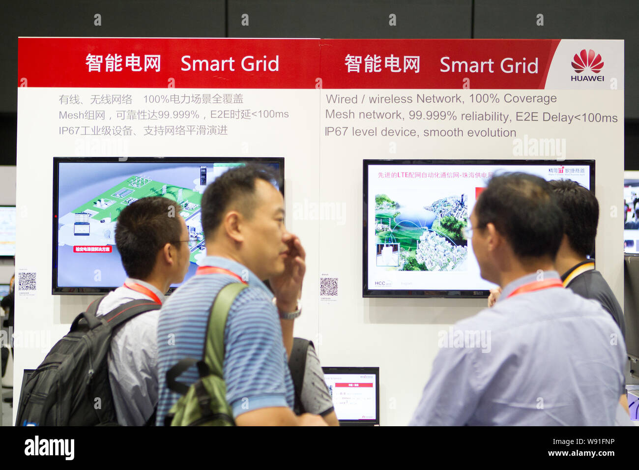 People visit the stand of Huawei Smart Grid during HCC 2013 (the 2013 Huawei Cloud Congress) in Shanghai, China, 2 September 2013.   Huawei Technologi Stock Photo