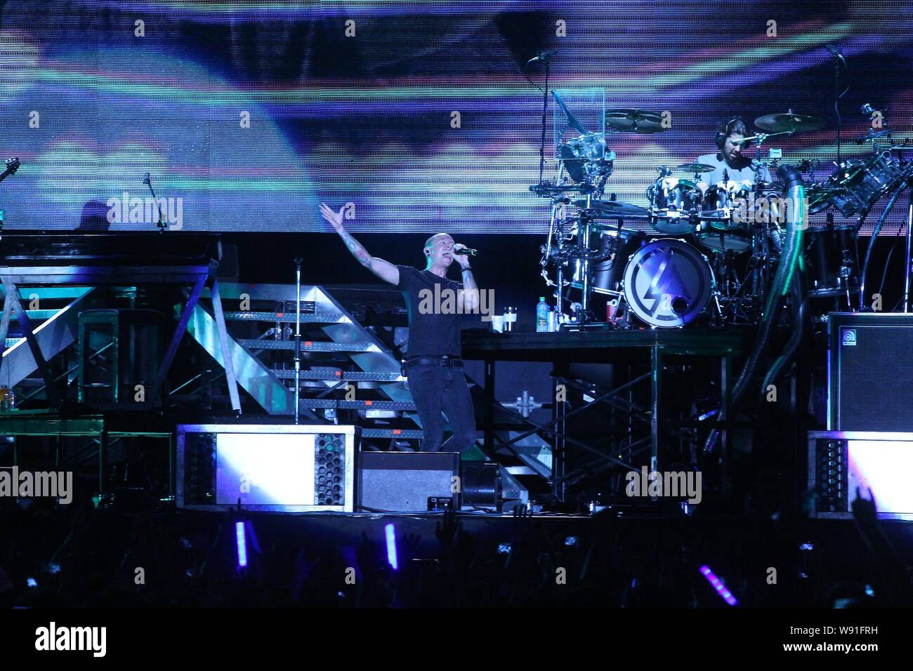 Members of American rock band Linkin Park perform during a concert in Taipei, Taiwan, 17 August 2013. Stock Photo