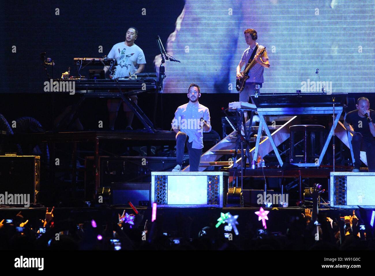 Members of American rock band Linkin Park perform during a concert in Taipei, Taiwan, 17 August 2013. Stock Photo