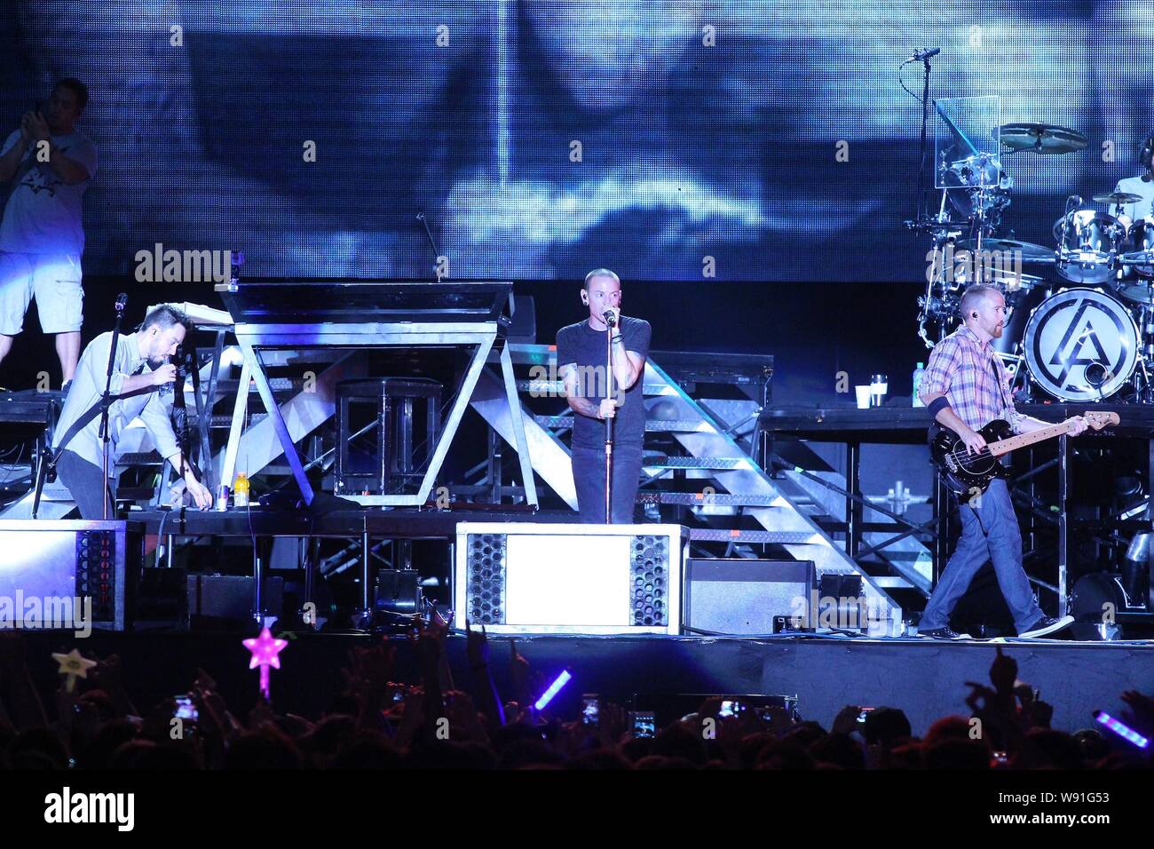 Members of American rock band Linkin Park perform during a concert in Taipei, Taiwan, 17 August 2013. Stock Photo
