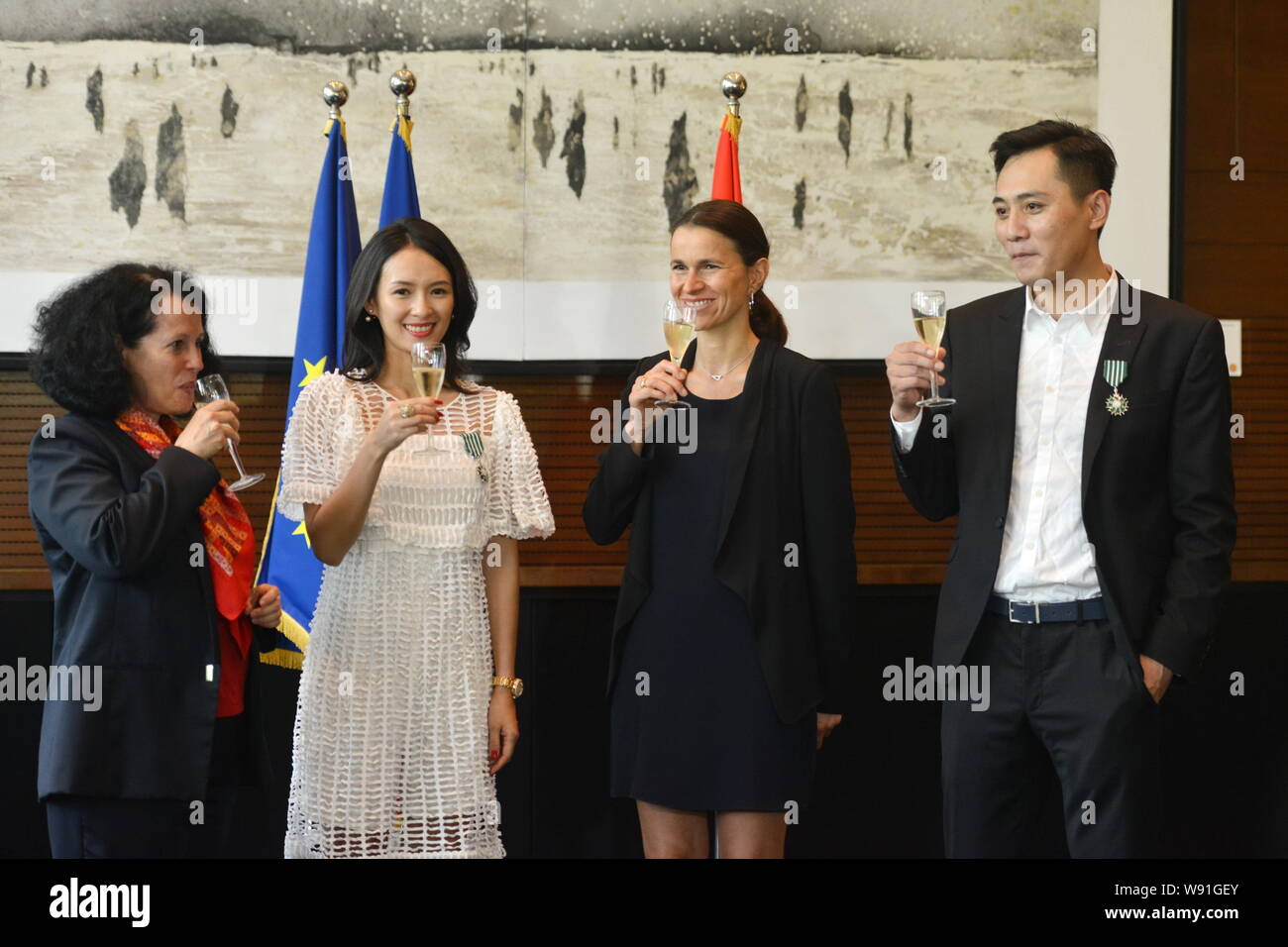 Aurelie Filippetti, second right, French Minister of Culture and Communication, Chinese actress Zhang Ziyi, second left, and actor Liu Ye, right, toas Stock Photo