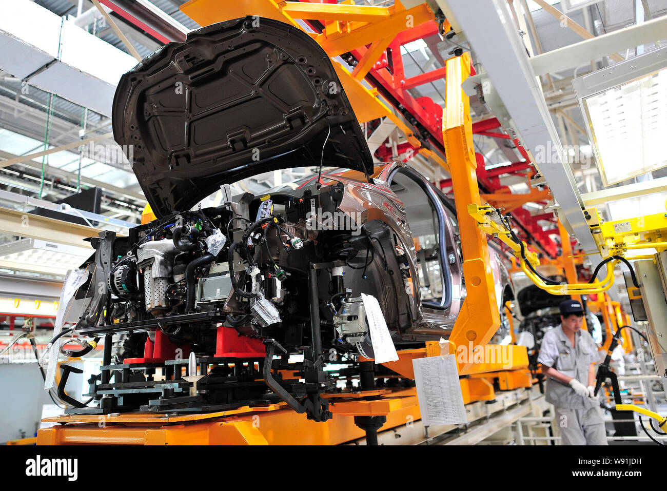 A Chinese worker assembles a Citroen car on the assembly line at the ...