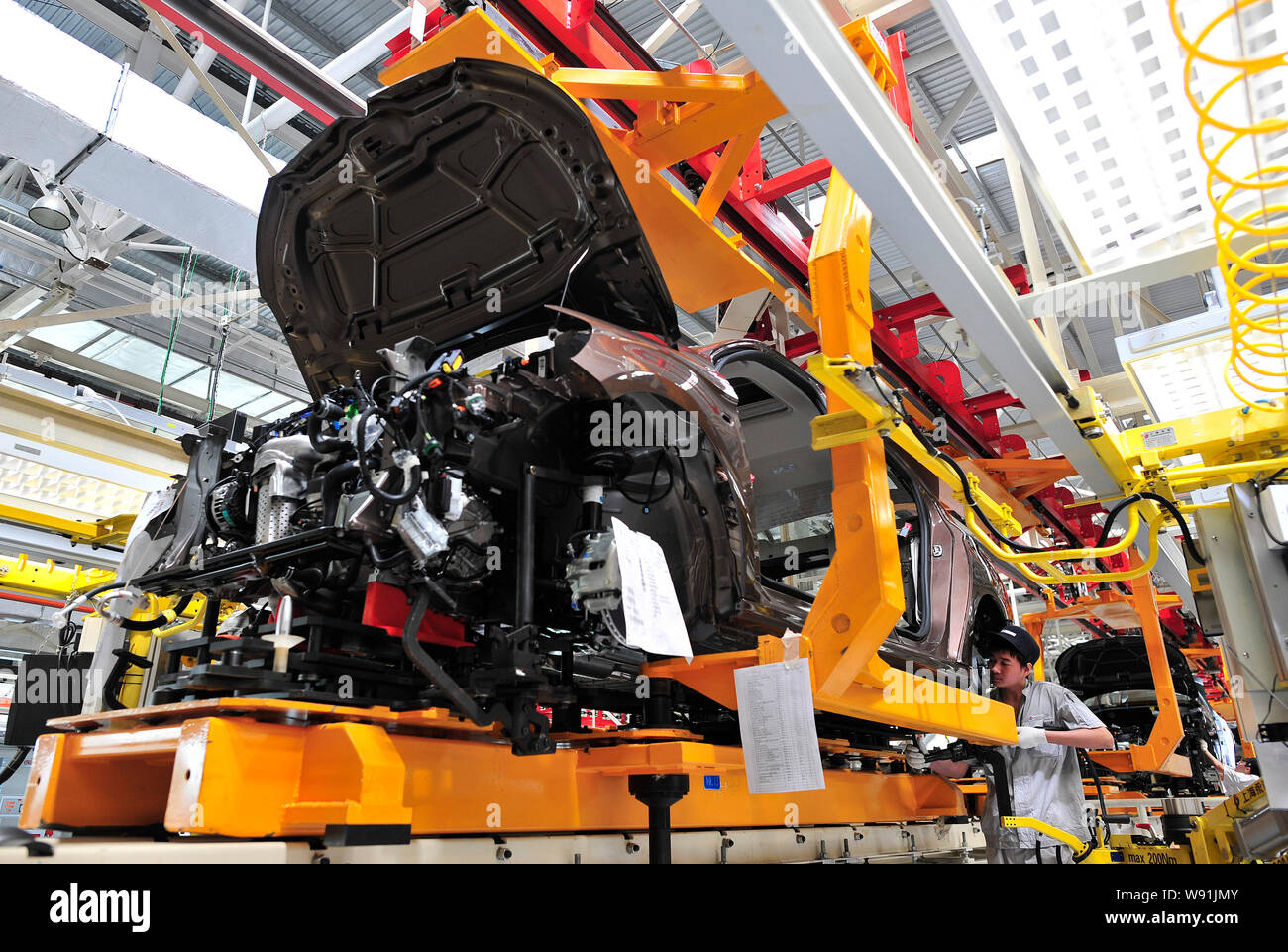 A Chinese worker assembles a Citroen car on the assembly line at the ...