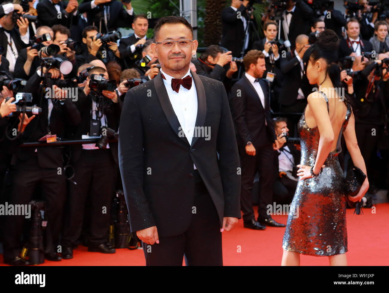Chinese actor Jiang Wu poses on the red carpet as he arrives for the ...