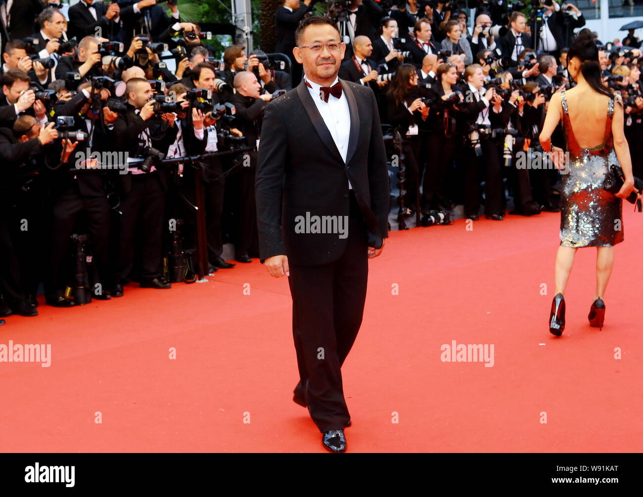 Chinese actor Jiang Wu poses on the red carpet as he arrives for the ...