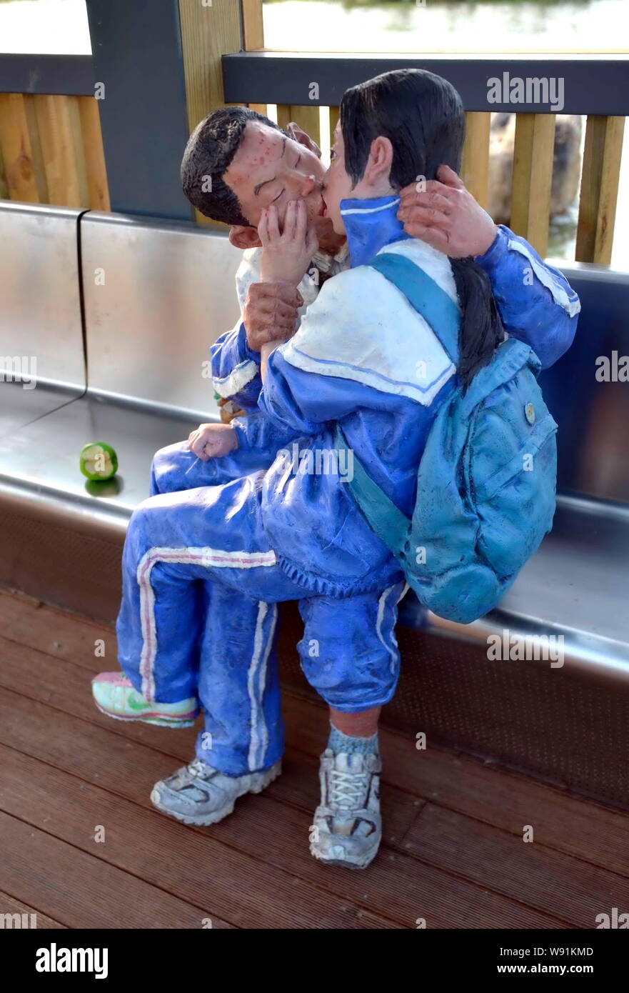 A statue showing two middle school students kissing each other is displayed at a park in Zhangzhou city, southeast Chinas Fujian province, 24 May 2013 Stock Photo