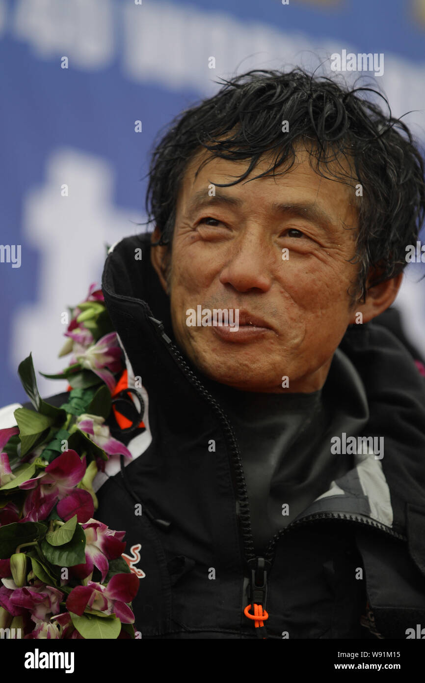 Chinas Guo Chuan smiles after returning home in Qingdao city, east