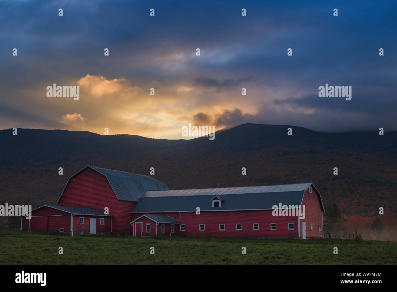Red barn at sunrise, Northern Vermont Stock Photo