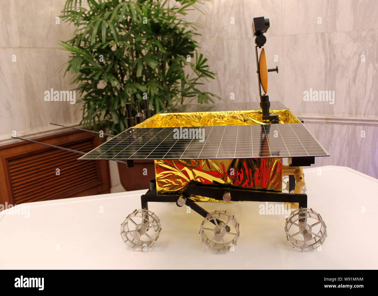 A model of Chinas first moon rover is displayed at a press conference for the rover in Beijing, China, 25 September 2013.   Chinese scientists unveile Stock Photo