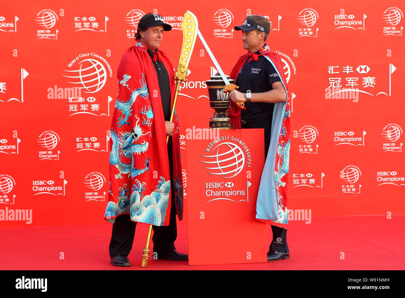 American golfer Phil Mickelson, left, poses with English golfer Ian Poulter during the opening ceremony for the WGC-HSBC Golf Champions 2013 in Shangh Stock Photo