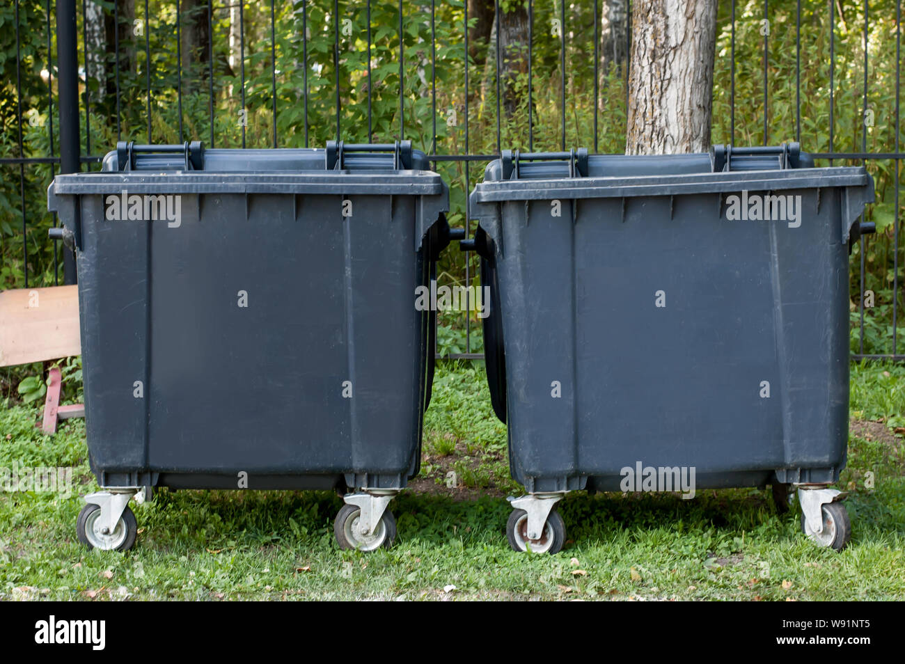 Dumpsters with lid in park. One garbage outdoor. View side Stock Photo Alamy