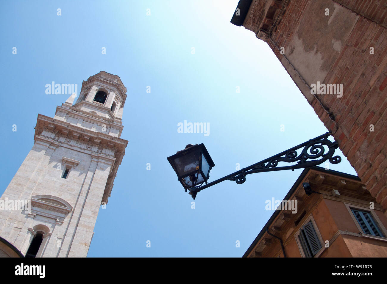Low angle views of Verona Cathedral seen through residential houses, Verona, Italy Stock Photo