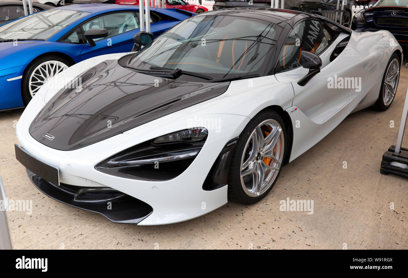 View of a McLaren 720S Spyder on display in the International Paddock, at the 2019 Silverstone Classic Stock Photo