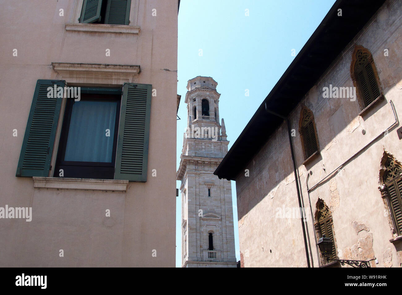 Low angle views of Verona Cathedral seen through residential houses, Verona, Italy Stock Photo