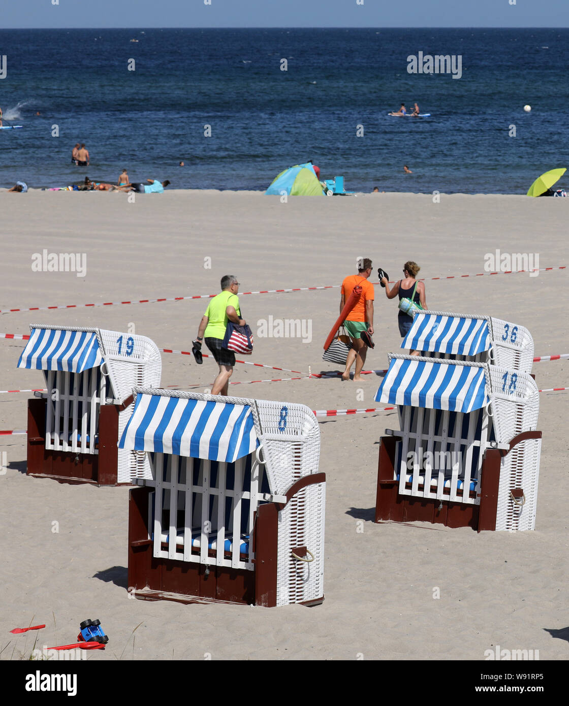 12 August 2019, Mecklenburg-Western Pomerania, Kühlungsborn: At the Baltic Sea beach beach chairs are empty. After the end of the holidays in half of the federal states, things are a little more relaxed on the coast as well; in another five federal states, the holidays are coming to an end this week. Photo: Bernd Wüstneck/dpa-Zentralbild/dpa Stock Photo