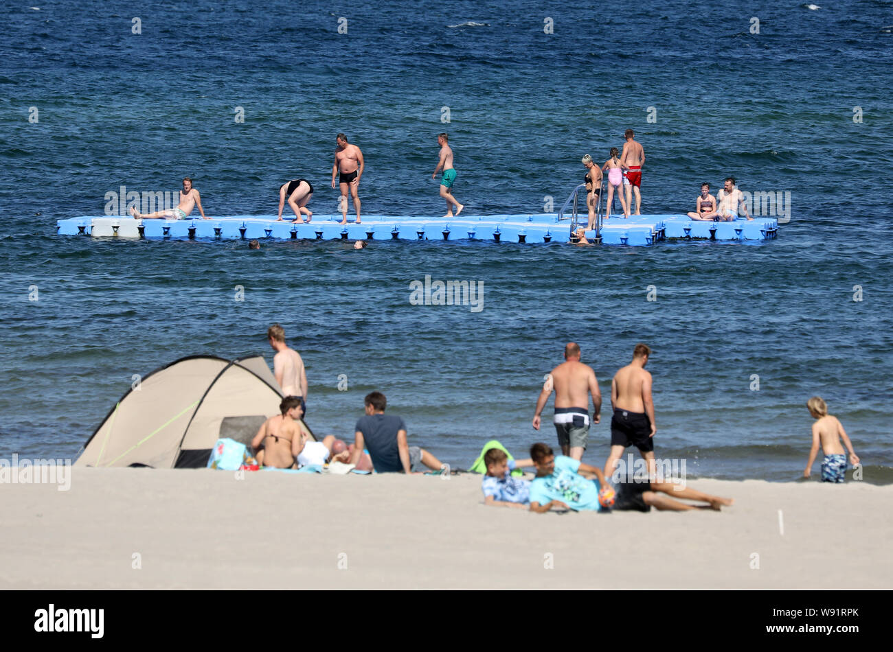 12 August 2019, Mecklenburg-Western Pomerania, Kühlungsborn: At the beach of the Baltic Sea bathers have arrived. After the end of the holidays in half of the federal states, things are a little more relaxed on the coast as well; in another five federal states, the holidays are coming to an end this week. Photo: Bernd Wüstneck/dpa-Zentralbild/dpa Stock Photo