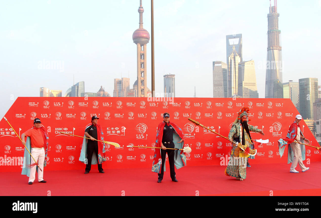 (From left) Jason Dufner and Phil Mickelson of the United States, Ian Poulter of England, a Chinese performer and Justin Rose of England, all dressed Stock Photo