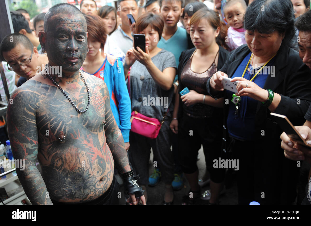 Liu Ming, the Chinese tattoo enthusiast is seen on a street in Taiyuan ...