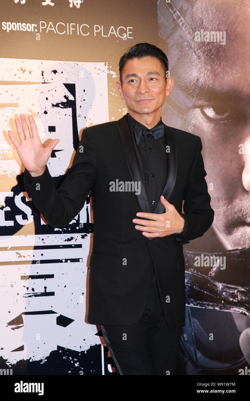 Hong Kong singer and actor Andy Lau waves at a premiere for his new 3D movie, Firestorm, in Hong Kong, China, 15 December 2013. Stock Photo