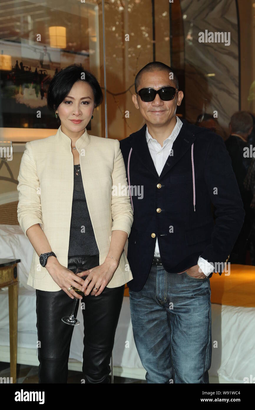 Hong Kong actress Carina Lau, left, and her actor husband Tony leung chiu wai pose during an opening ceremony for Hong Kong entrepreneur Sir David Tan Stock Photo