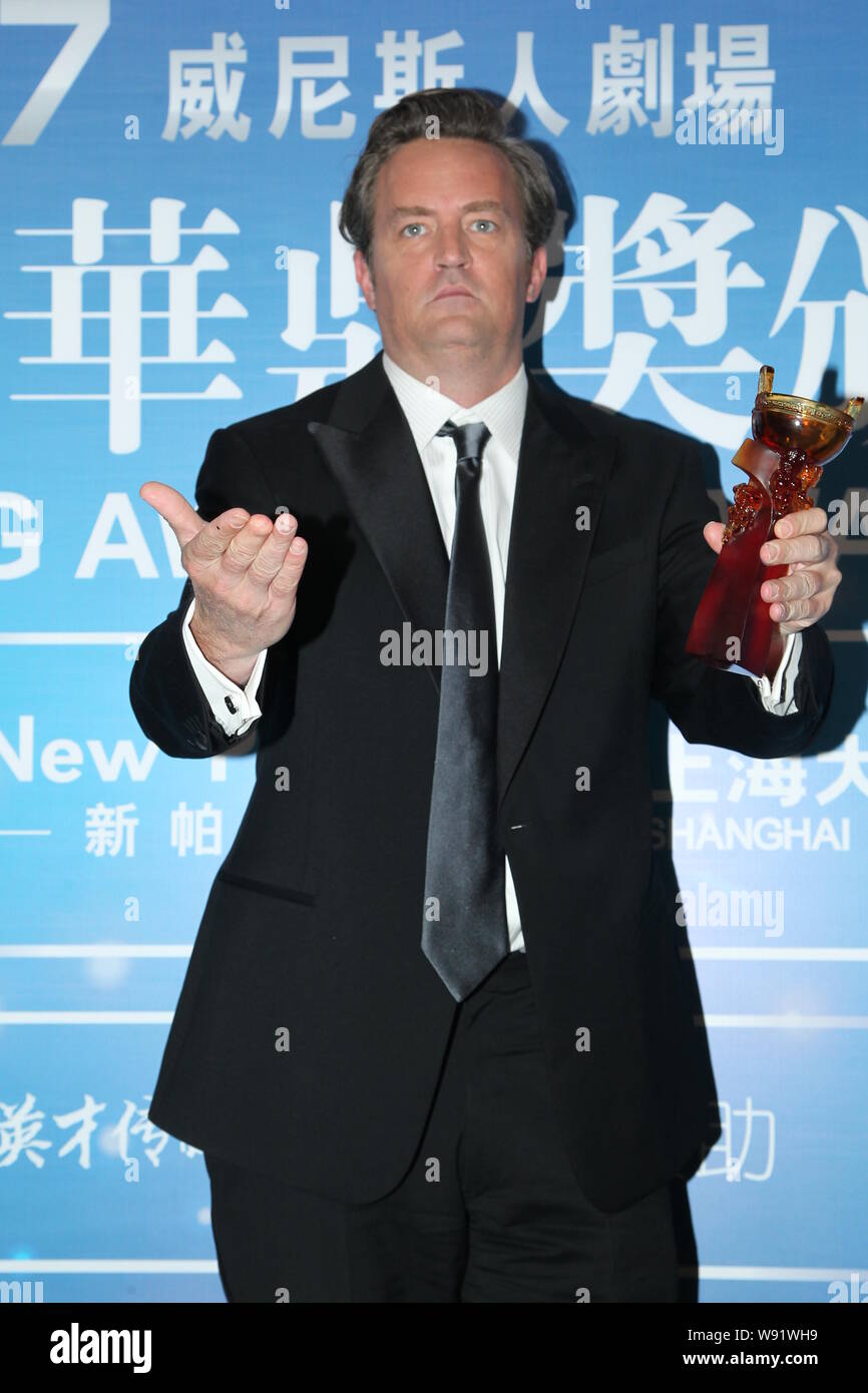 American actor Matthew Perry holds his trophy at the back stage of the award presentation ceremony after he wins the Best Global Television Actor Awar Stock Photo