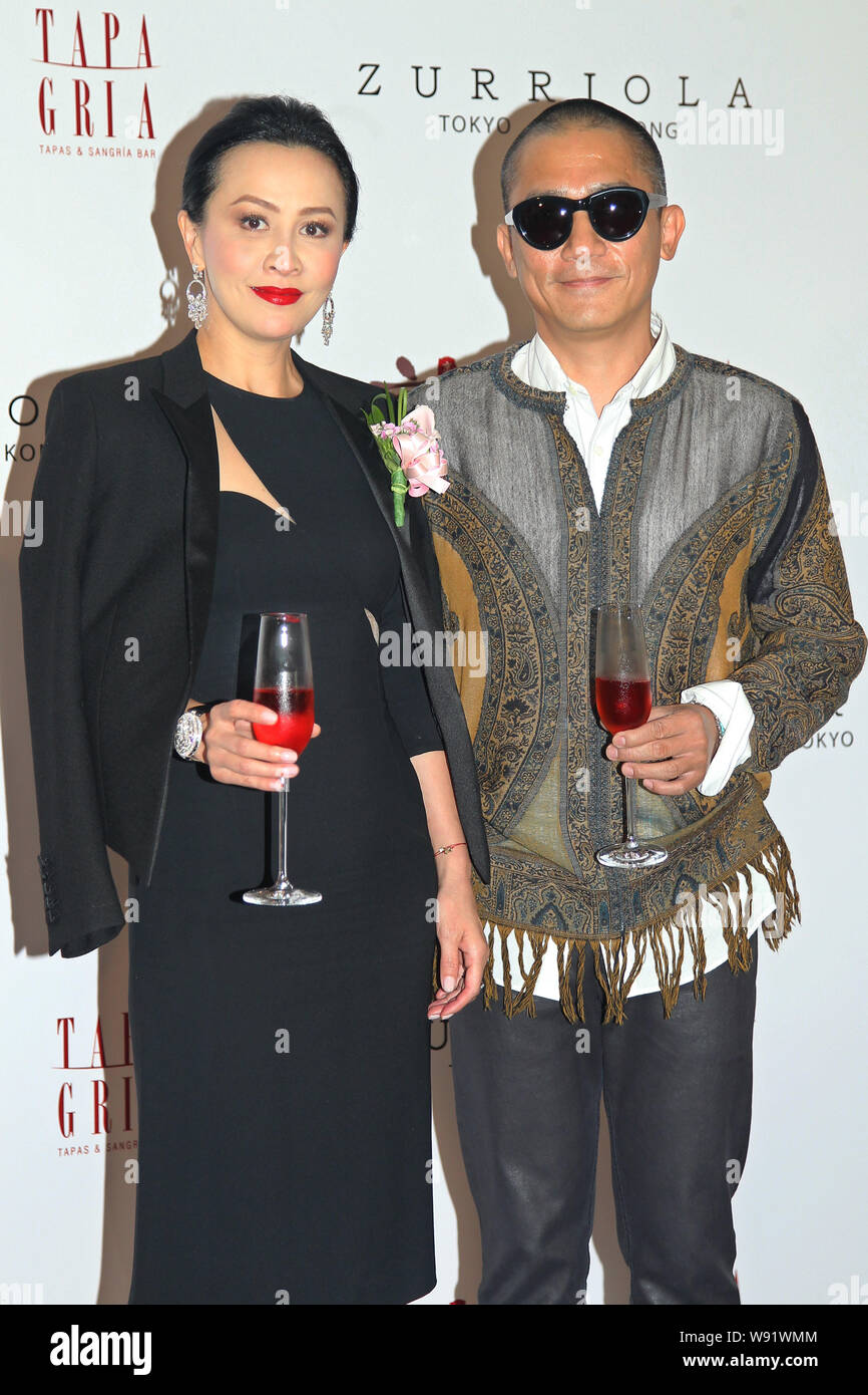 Hong Kong actor Tony Leung Chiu Wai, right, and his actress wife Carina Lau propose toasts during the opening ceremony for Carina Laus restaurants in Stock Photo
