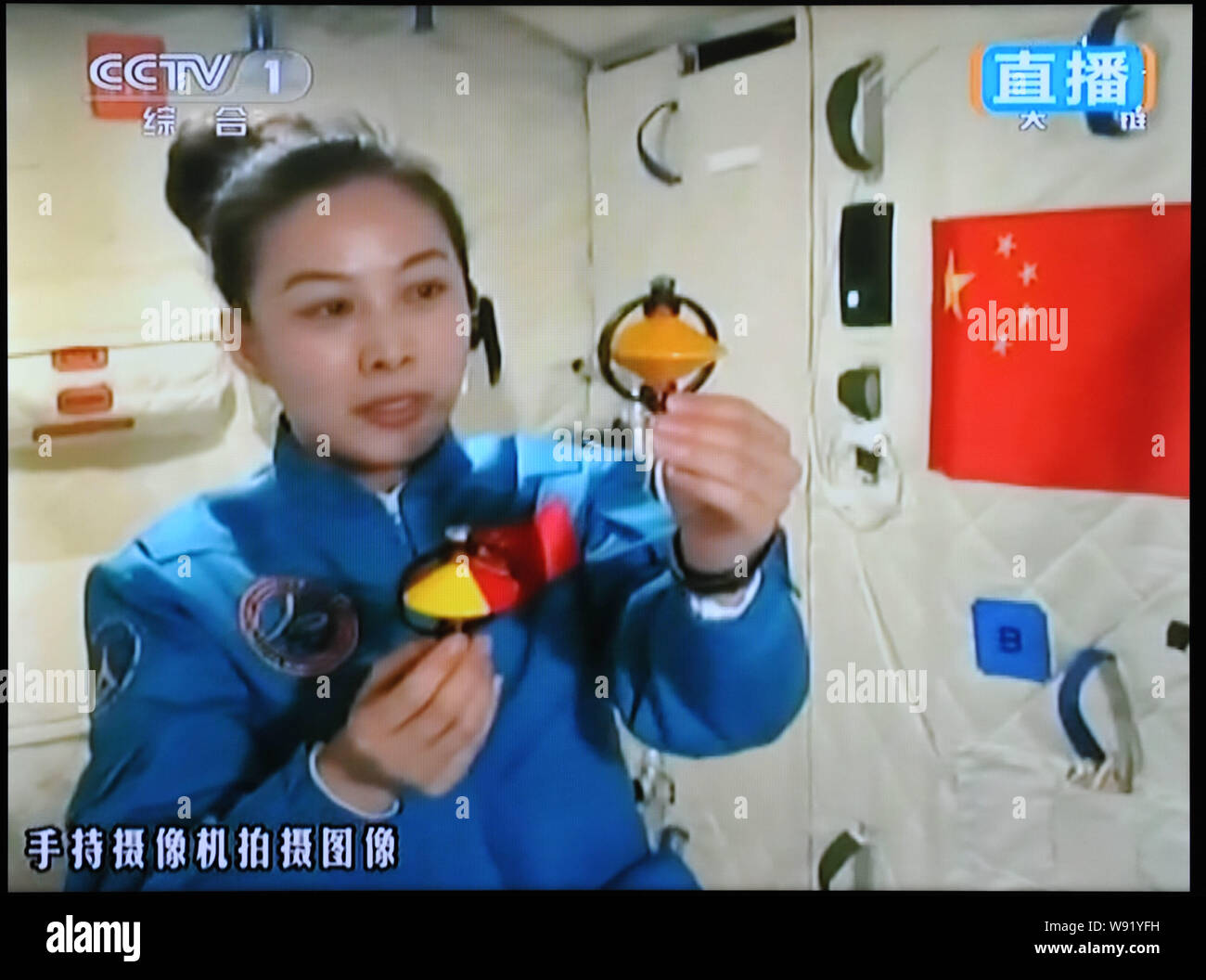 In this TV grab, Chinese astronaut Wang Yaping gives a lecture to students via live video from the Tiangong-1 space lab, 20 June 2013.   Chinas second Stock Photo