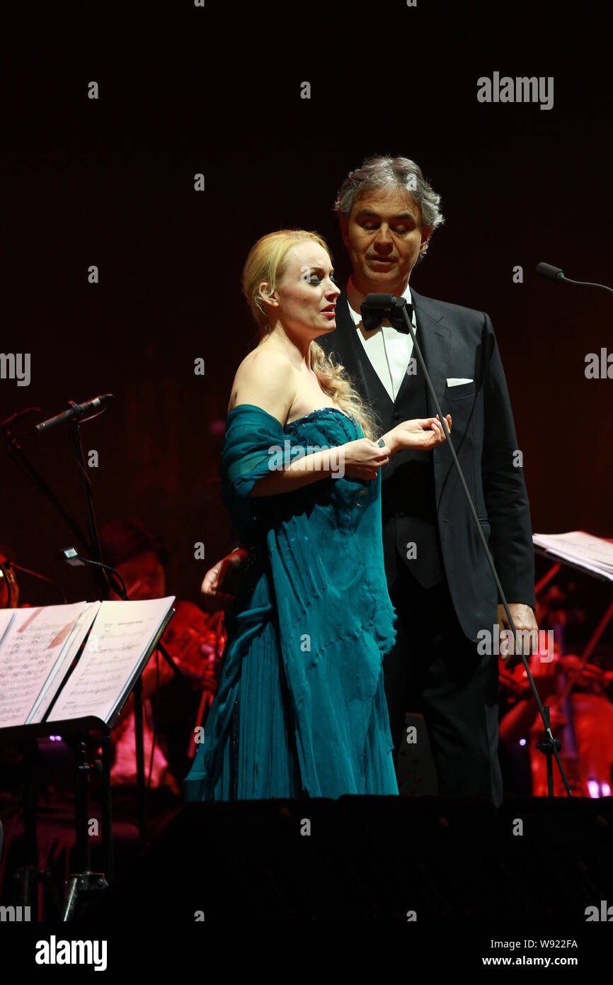 Italian classical singer Andrea Bocelli (right) performs during his concert in Shanghai, China, 30 April 2013. Stock Photo