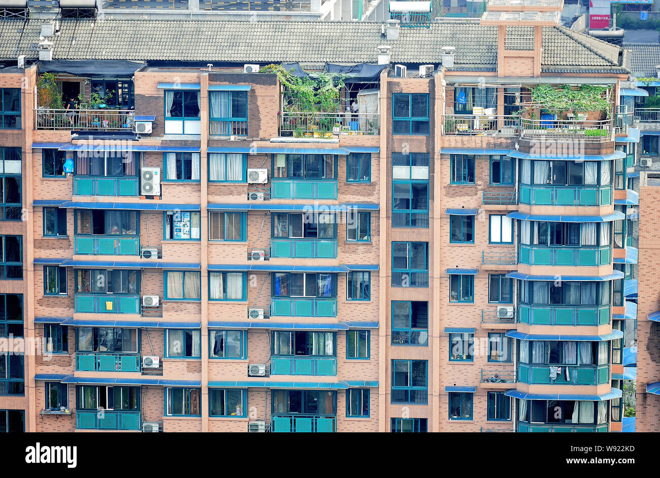 Private gardens are seen on the rooftop of residential apartment buildings in Hangzhou city
