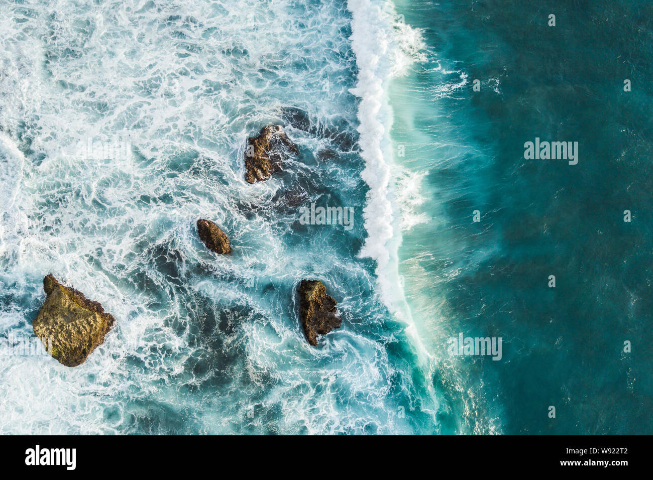 Aerial view of crashing waves on rocks. View from above, drone photo, beautiful nature background Stock Photo