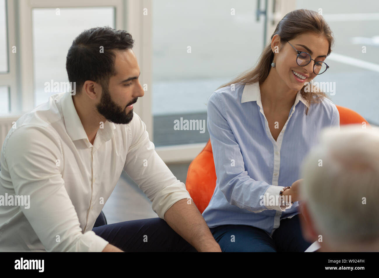 Charming young female presenting her business idea Stock Photo