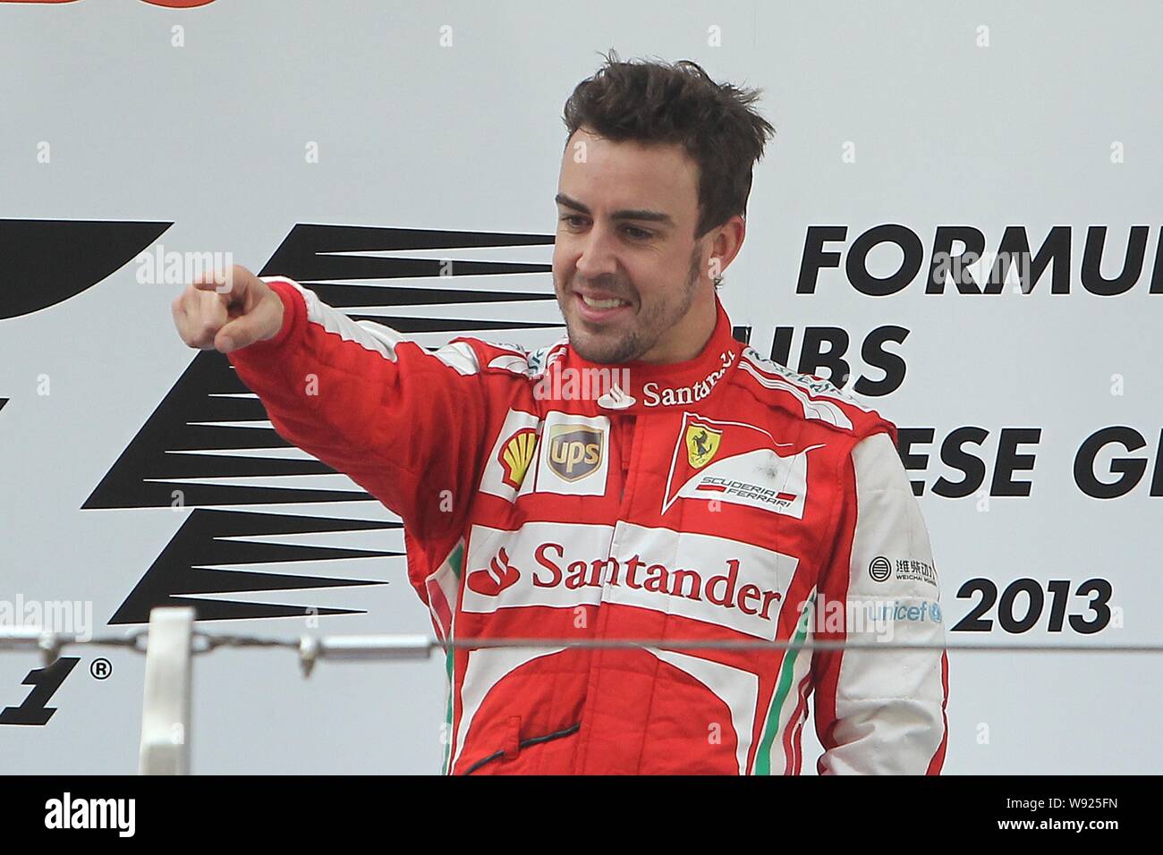 Spanish F1 driver Fernando Alonso of Ferrari gestures to celebrate after  winning the 2013 Formula One Chinese Grand Prix at the Shanghai  International Stock Photo - Alamy
