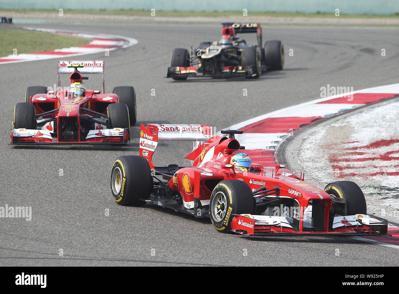 From front) Spanish F1 driver Fernando Alonso of Ferrari, his Brazilian teammate Felipe Massa and Finnish F1 driver Kimi Raikkonen of Lotus compete d Stock Photo - Alamy