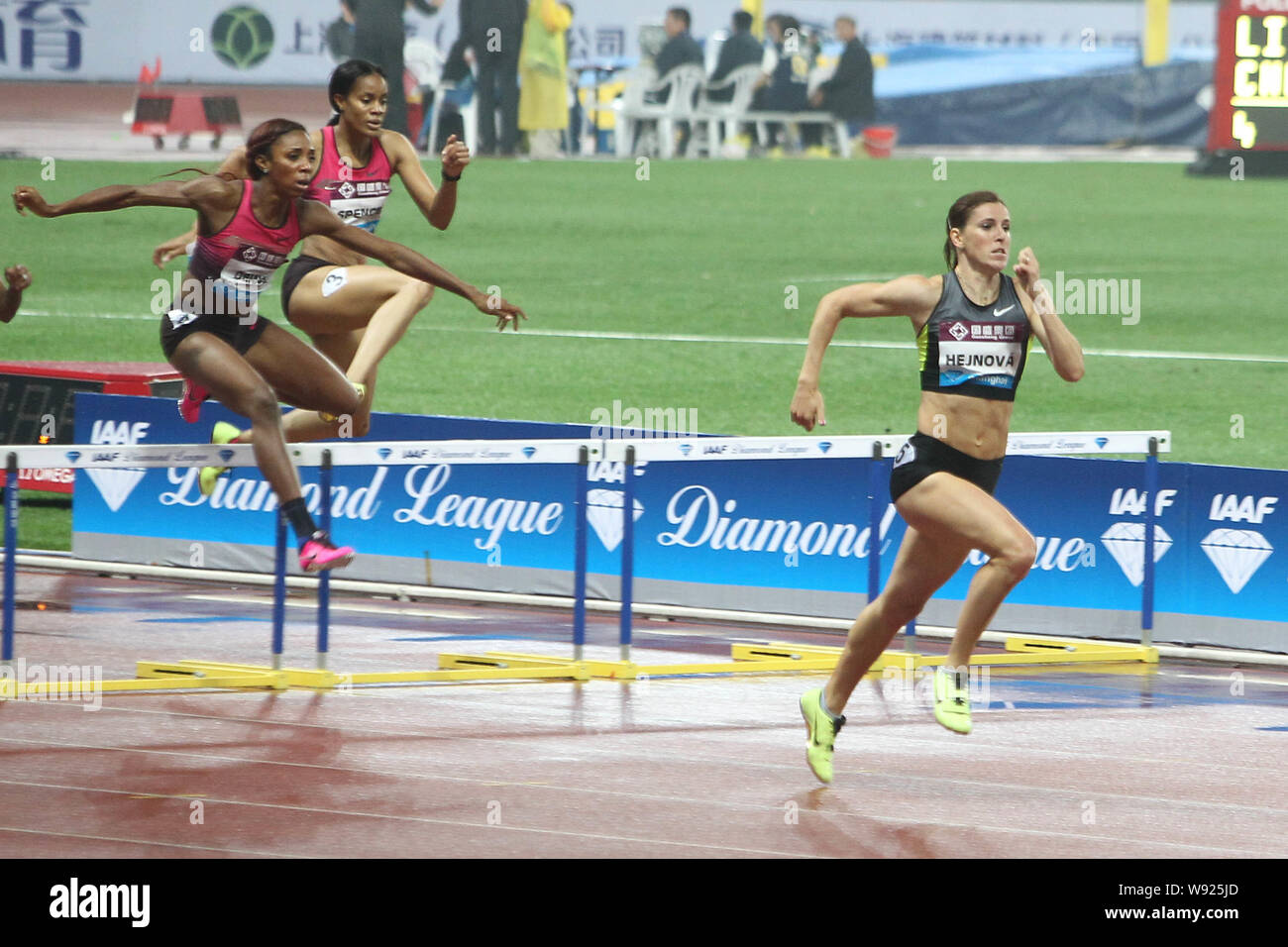 Zuzana Hejnova of The Czech Republic, right, and other athletes compete in the womens 400m hurdles event at the 2013 IAAF Diamond League in Shanghai, Stock Photo