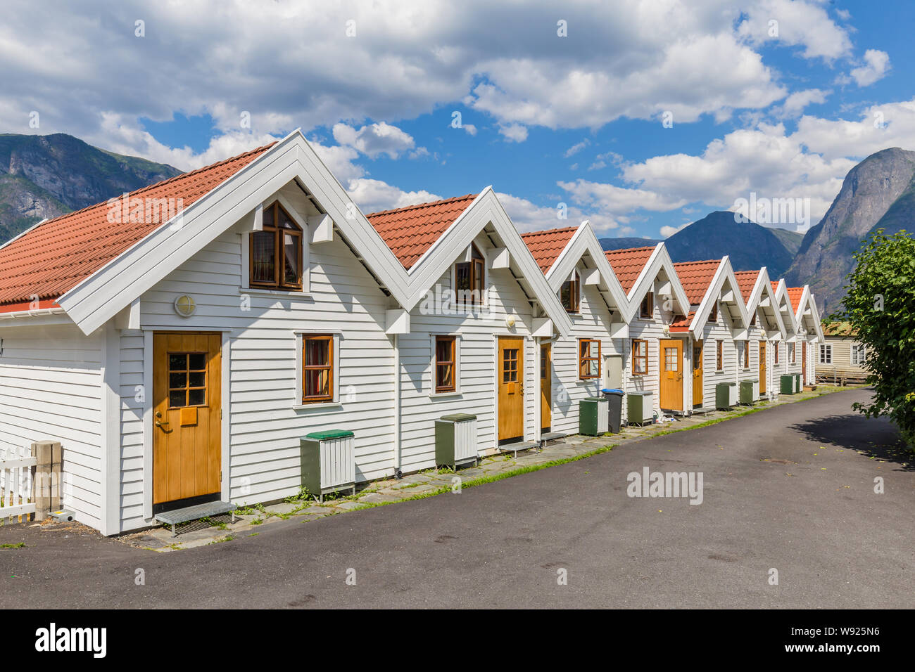 Beautiful traditional white wooden houses in Aurlandsvangen at the coast of Aurlandsfjord, branche of Sognefjord in Norway Stock Photo