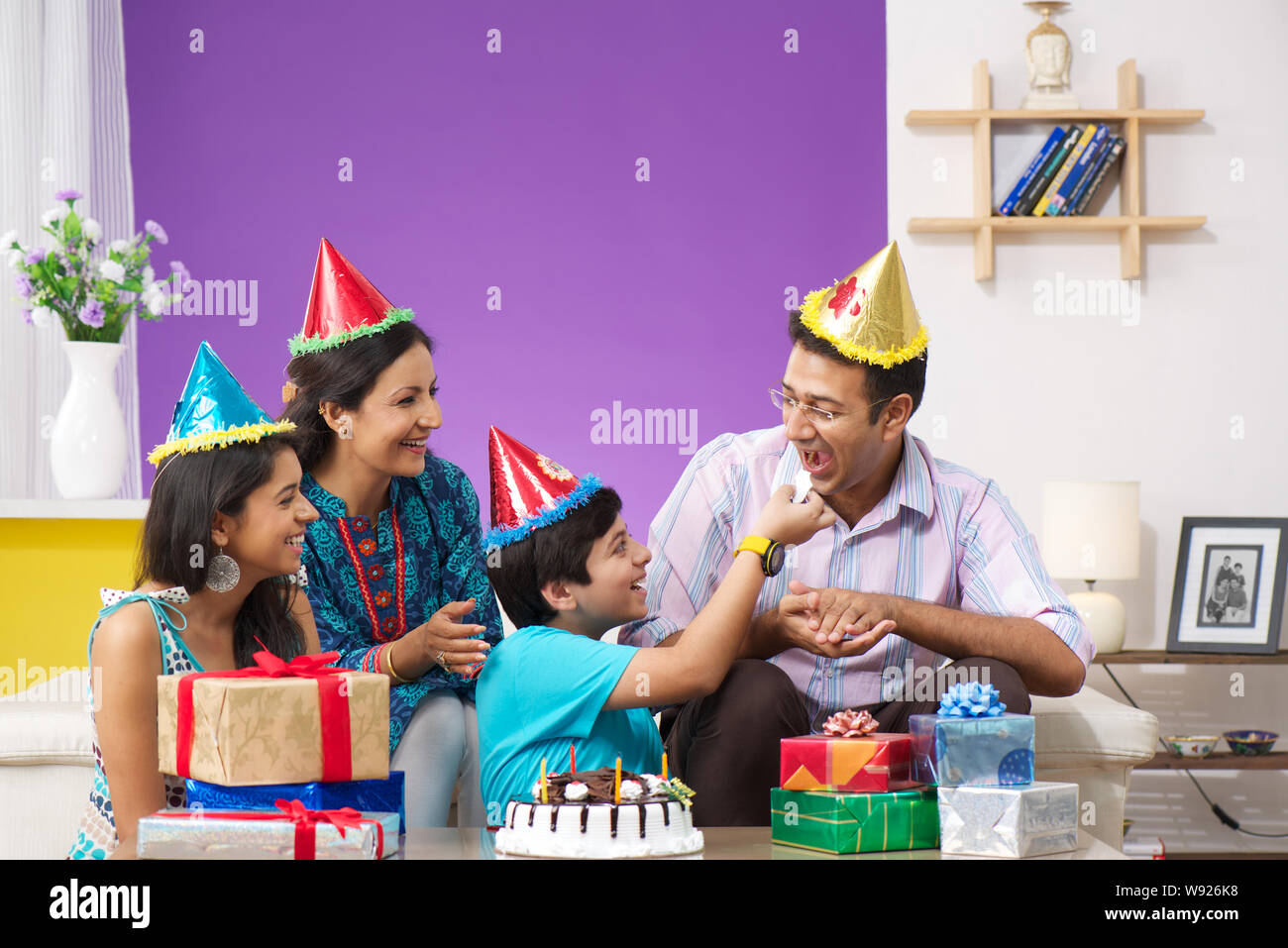 Family celebrating birthday Stock Photo