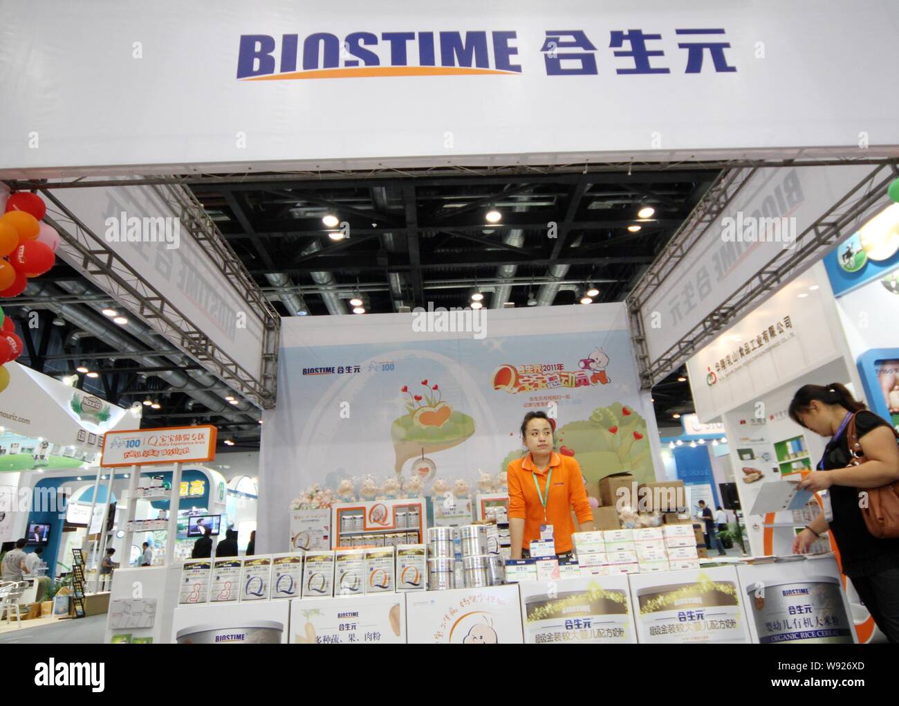 --FILE--A woman visits the stand of Biostime during a dairy product exhibition in Beijing, China, 16 September 2011.   Companies in China, whose taint Stock Photo